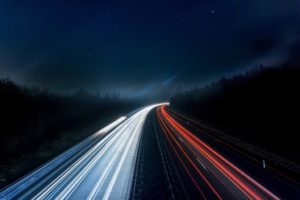 Red and white lights on a highway at night