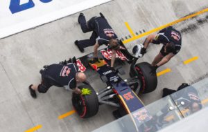 pit crew changing a cars tire